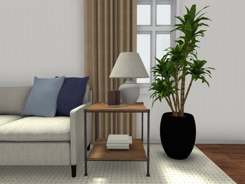 3D Photo of a side table by a couch with a lamp on top.
