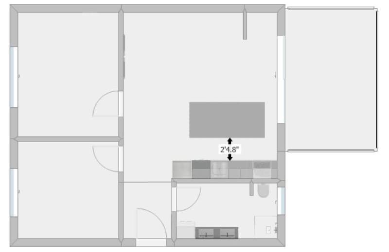 Floor plan illustrating the distance measurement between a kitchen counter and a kitchen island.