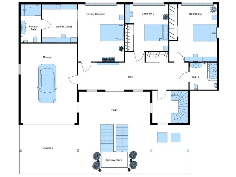 2D floor plan of the first floor in a reverse floor plan home, featuring a garage, three bedrooms, and a large outdoor patio.