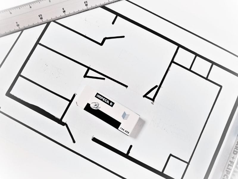Sketch of floor plan with eraser and ruler